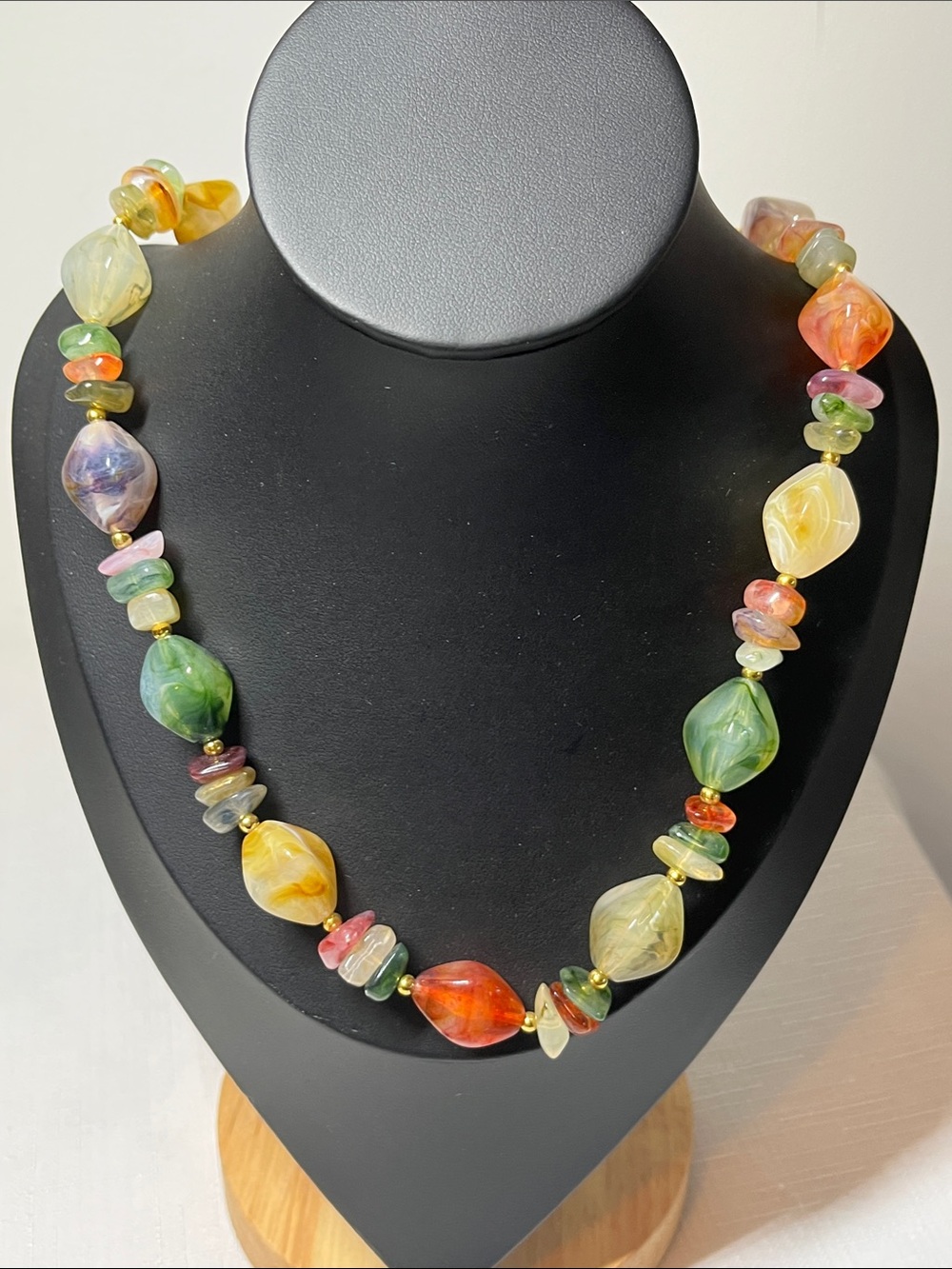 Vintage necklace with green orange cream, pink, white, and gold.